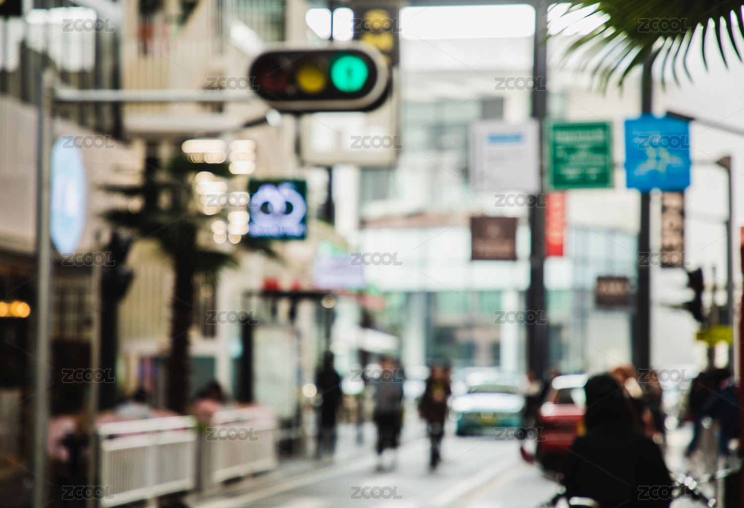 Blurred city scenery with people walking at the street