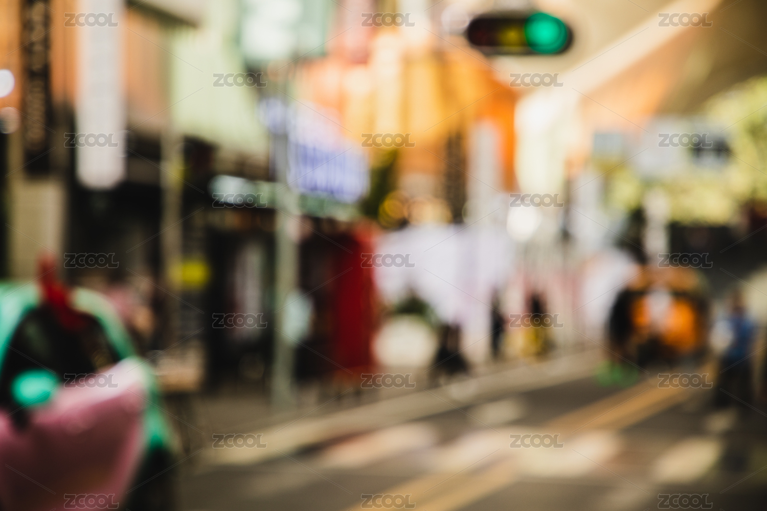 Blurred city scenery with people walking at the street