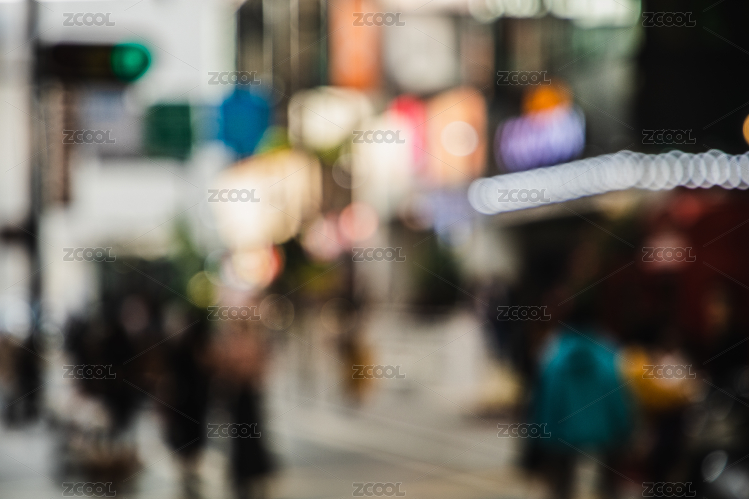 Blurred city scenery with people walking at the street